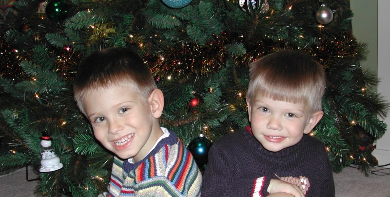 Kevin and Ryan in front of the Christmas tree