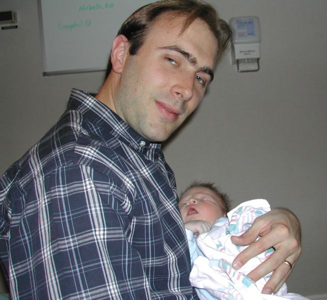 Matt holding newborn Ryan