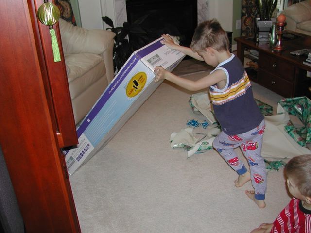 Kevin opening his big birthday present - an electronic keyboard