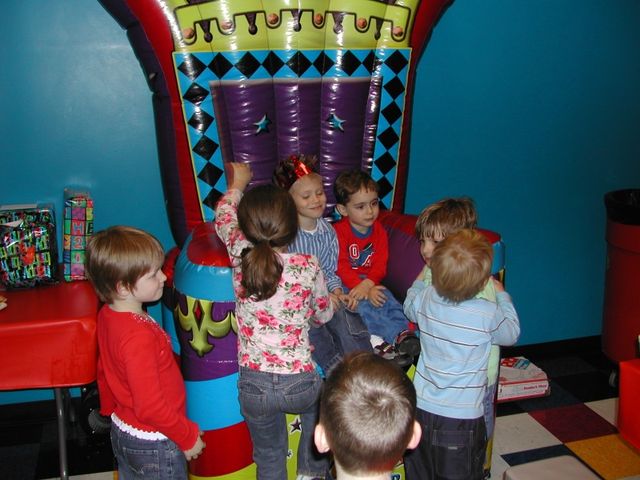 Kevin on the throne with his friends at Pump It Up for his 5th birthday party